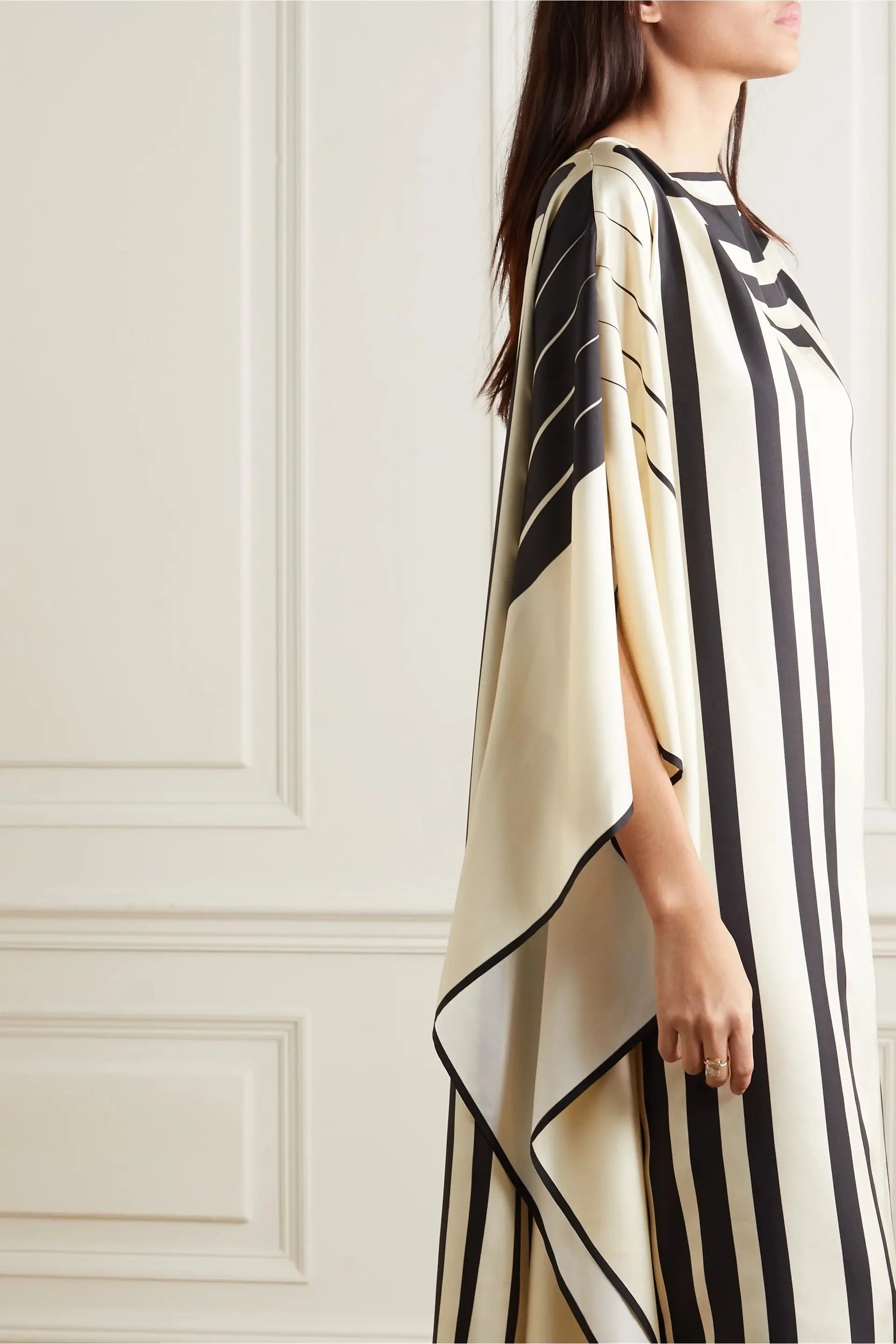 Woman wearing Vicharan Elegant Black & Cream caftan  standing sideways